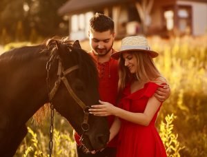 Romantic couples horseback riding